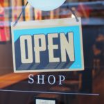 Open store sign in shop window